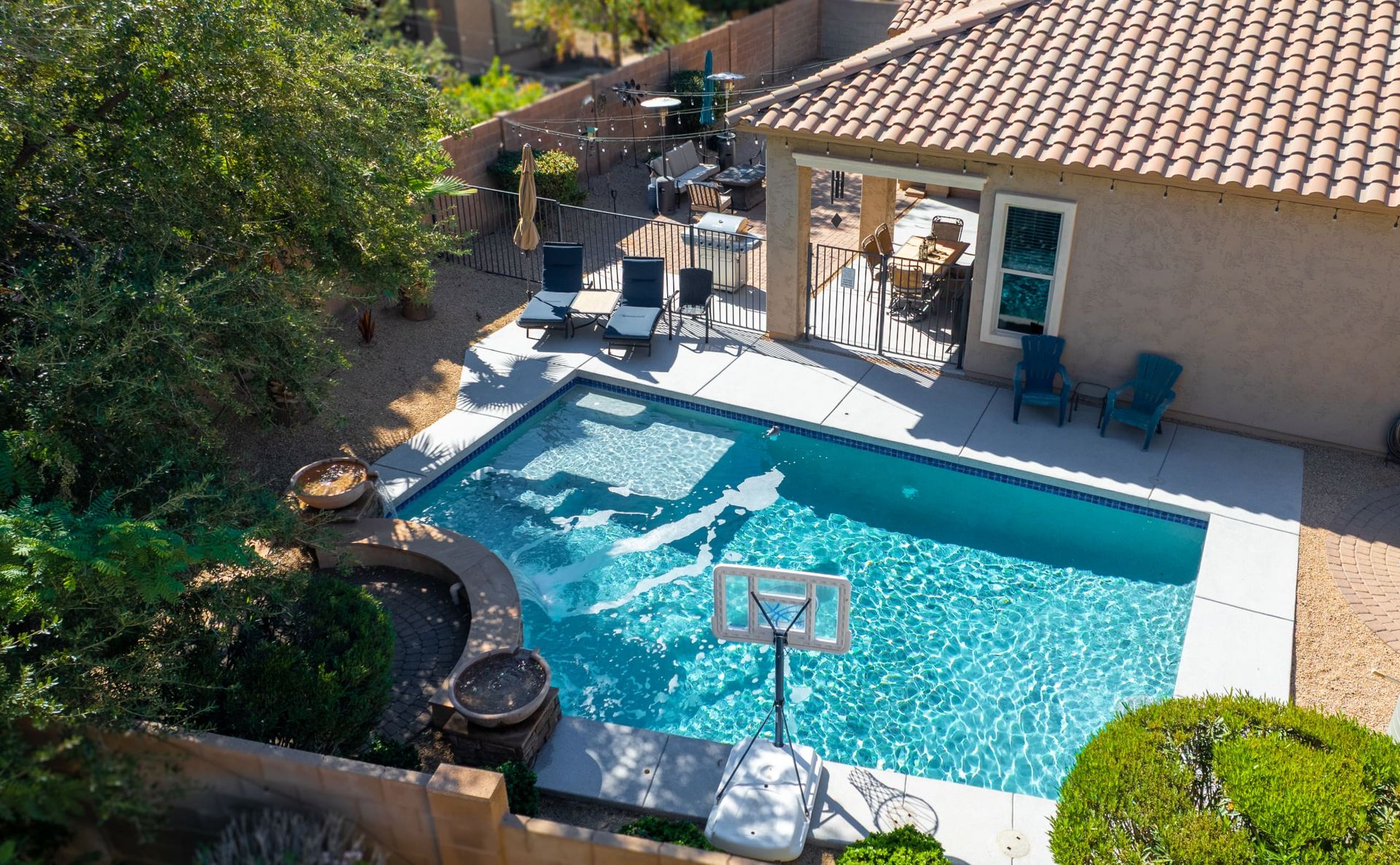 Backyard pool, patio and covered seating